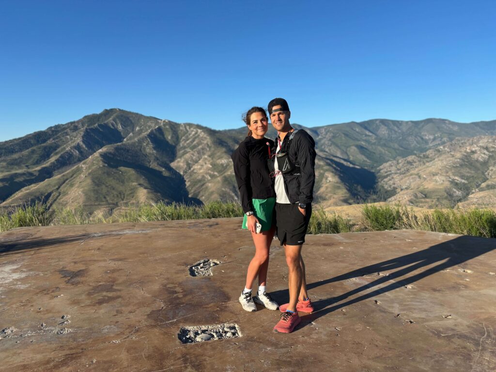 Dr. Nate Moller and his wife Emily on an early morning run near Pateros, Washington with the mountains behind them