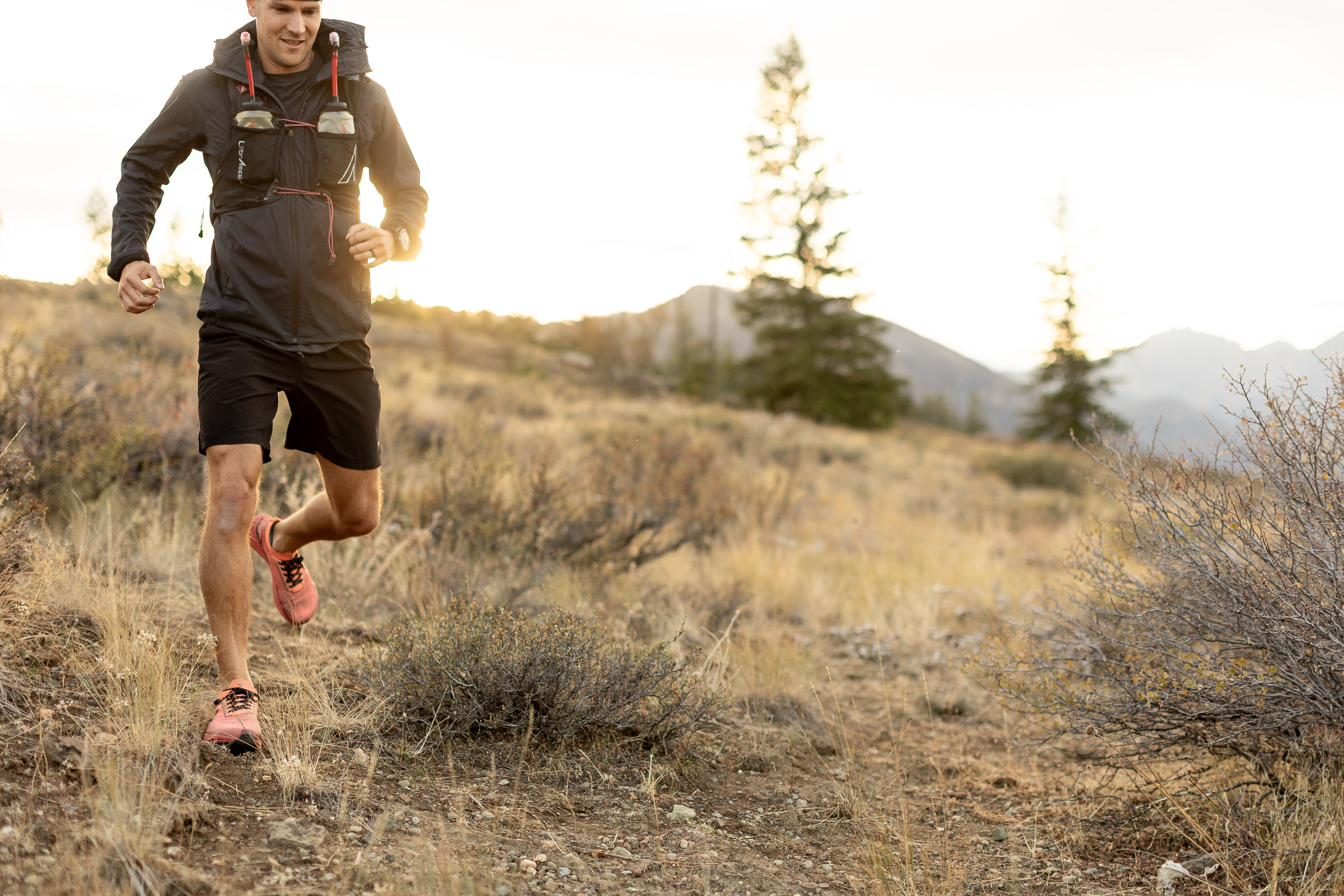 Chiropractic membership in Chelan: Dr. Nate Moller running a mountain trail above Lake Chelan