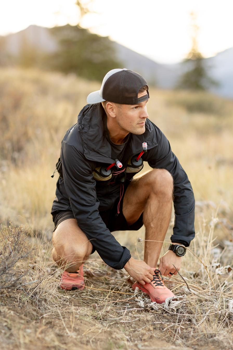 Dr. Nate lacing his trail running shoes