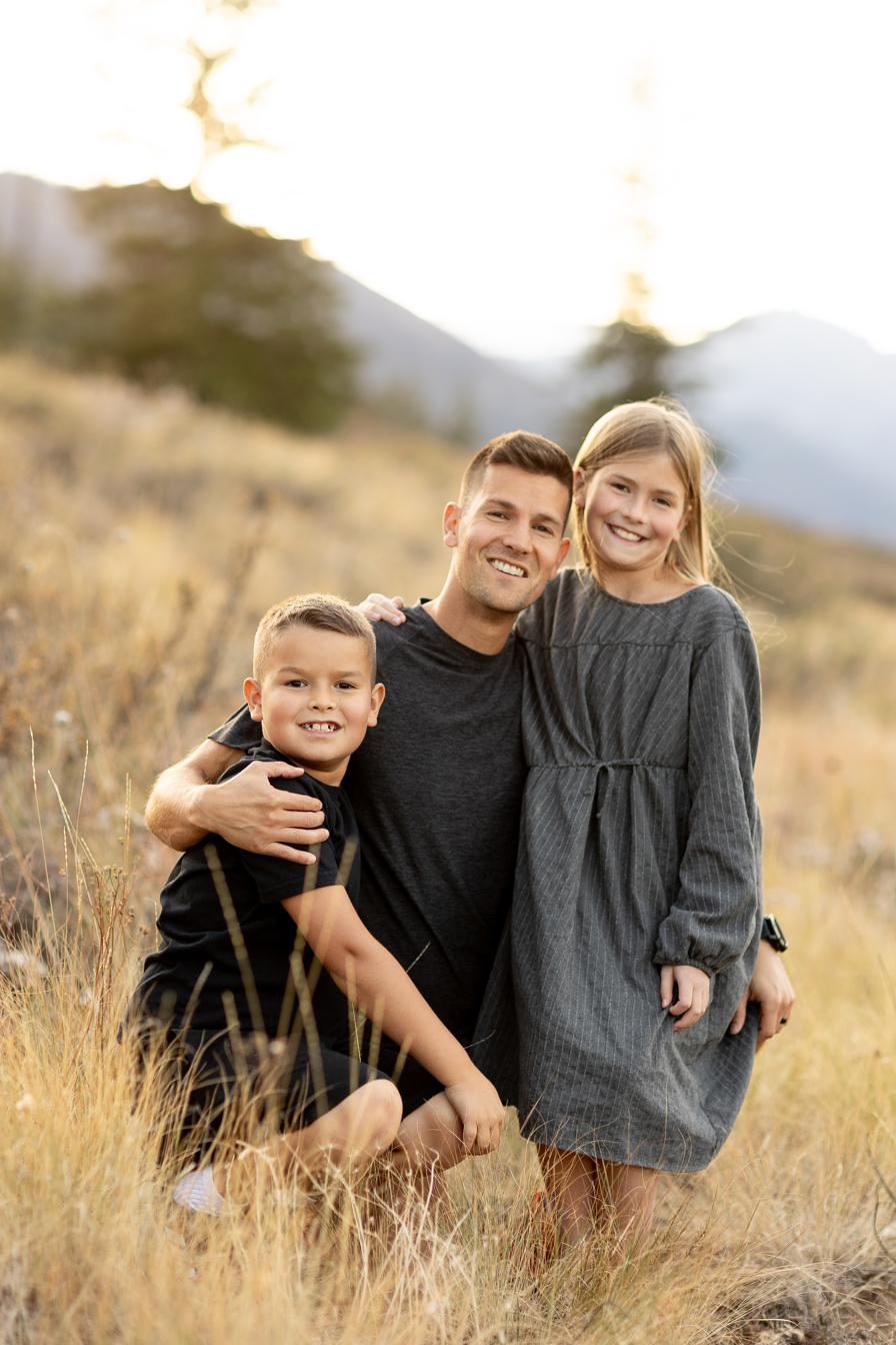 Dr. Nate Moller with his kids in the mountains near Chelan